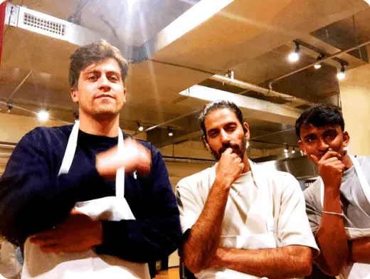 guys posing at nyc cooking party